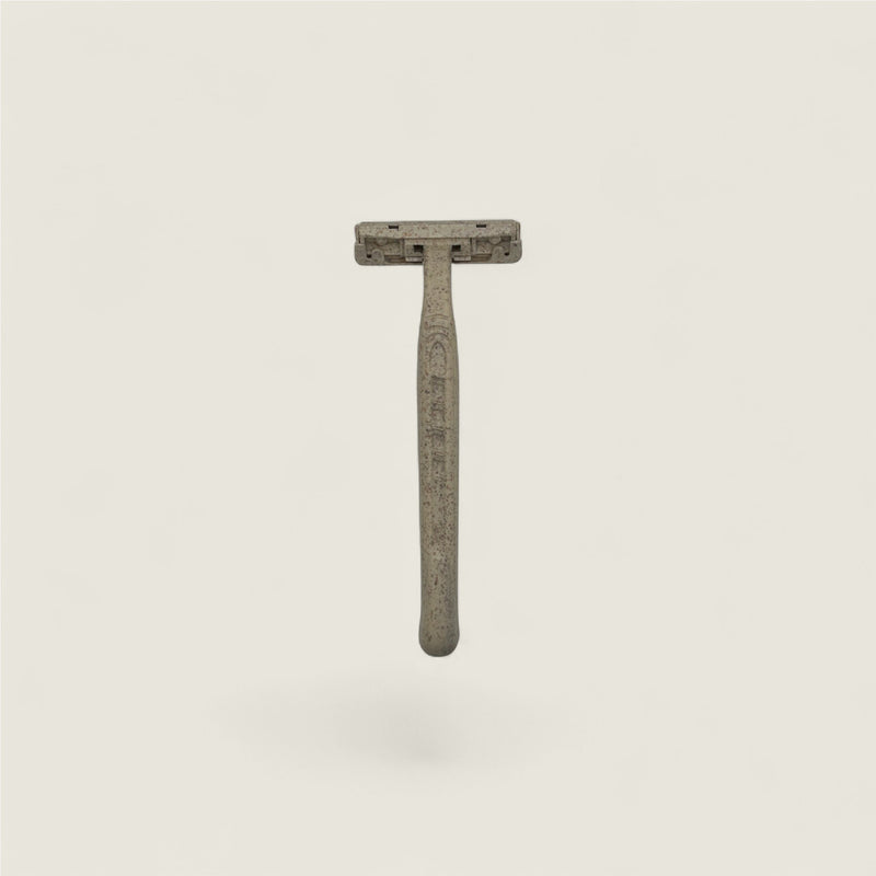 Safety razor on a light gray background