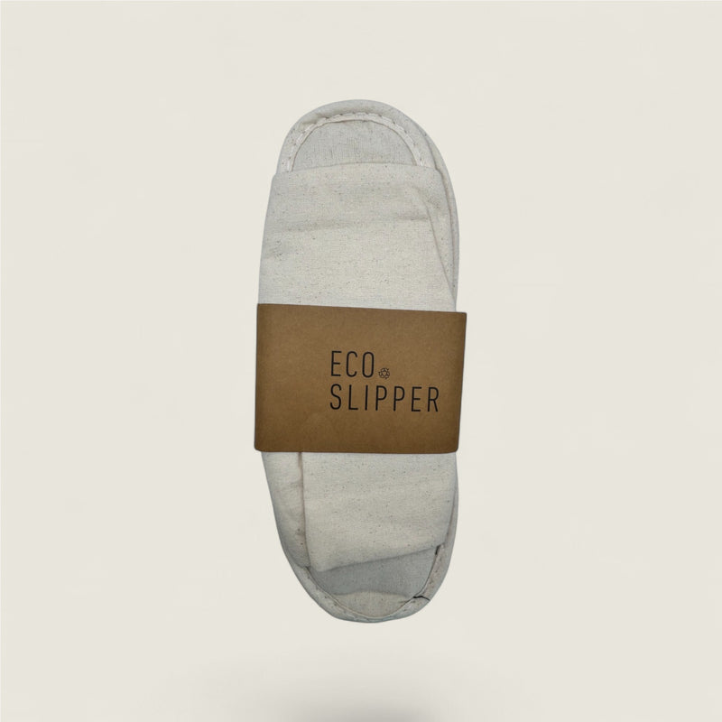 Gray slipper with a brown band labeled 'Eco Slipper' on a light beige background