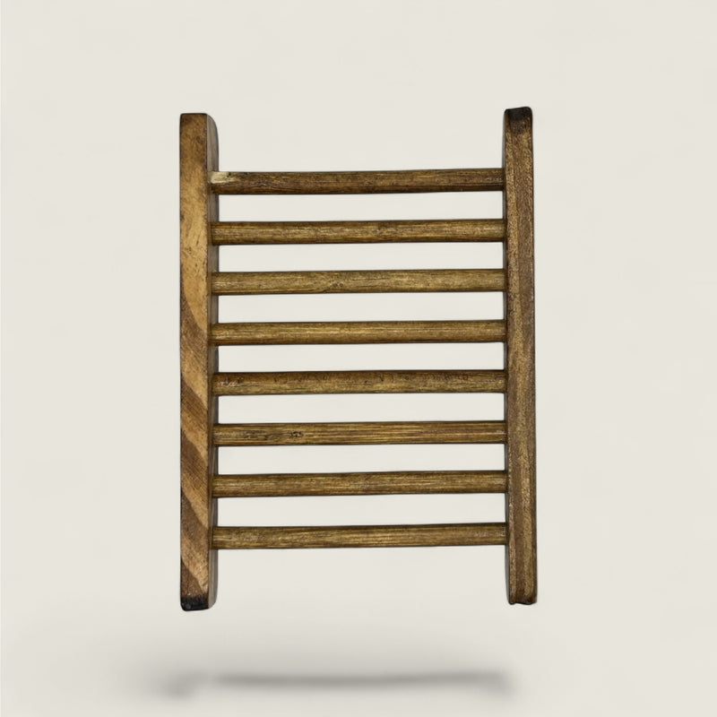 Wooden soap holder on a light gray background